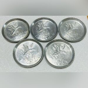 Vintage aluminum coasters, flying woodland duck pattern. Excellent condition!